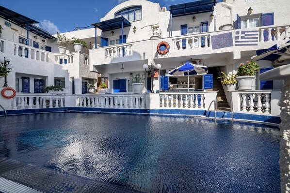 Seasonal outdoor pool, open 8:00 AM to 8:00 PM, pool umbrellas
