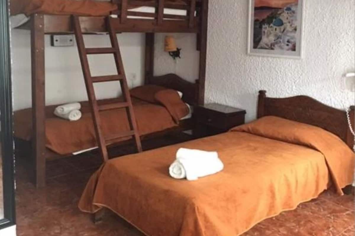 Economy Triple Room (Semi-Basement) | In-room safe, desk, soundproofing, iron/ironing board
