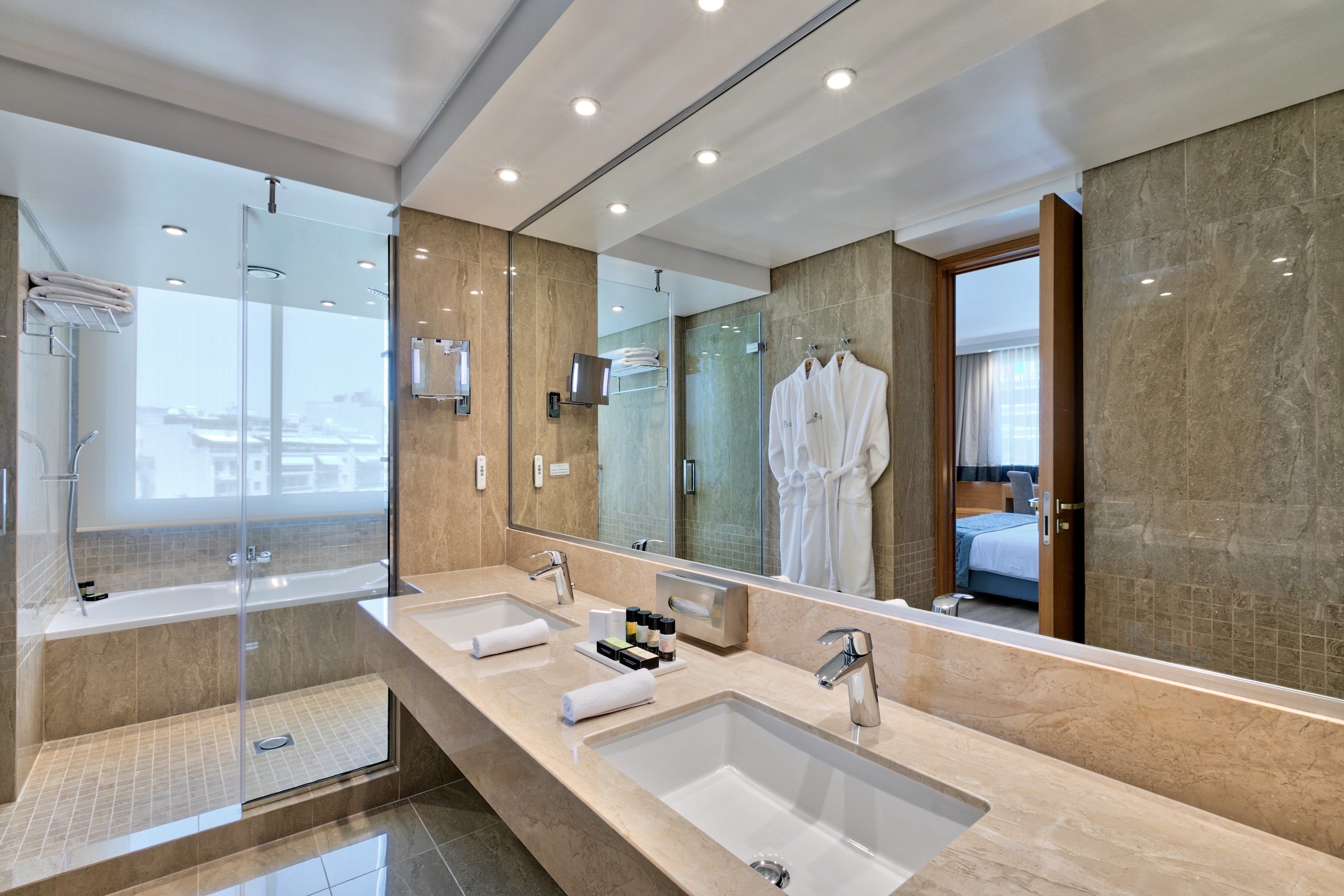 divine suite | bathroom | combined shower/bathtub, eco-friendly toiletries, hair dryer, towels