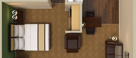 A compact hotel room with a bed, a desk, a chair, a small table, a sofa, a wardrobe, a mirror, a window, and a bathroom with a bathtub and toilet.