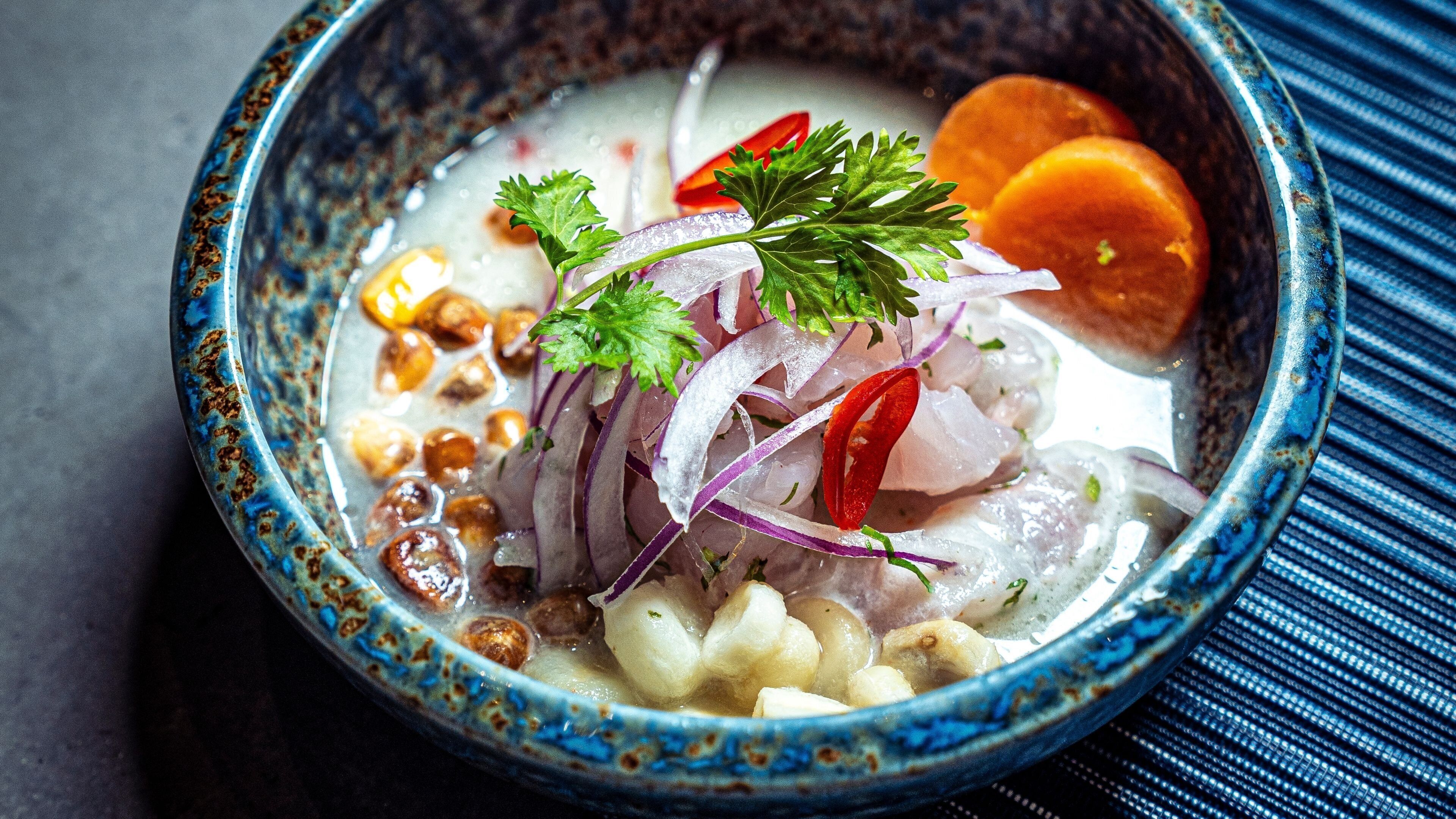 A bowl of food with various ingredients.