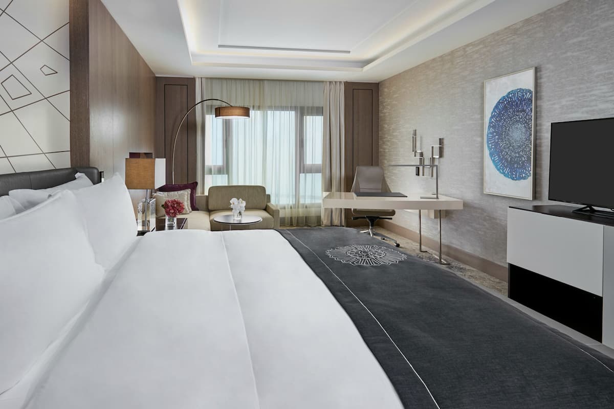 Premium bedding, down comforters, minibar, in-room safe