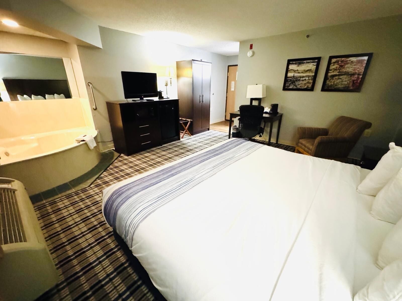 deluxe studio suite, 1 king bed, non smoking | desk, laptop workspace, blackout curtains, iron/ironing board