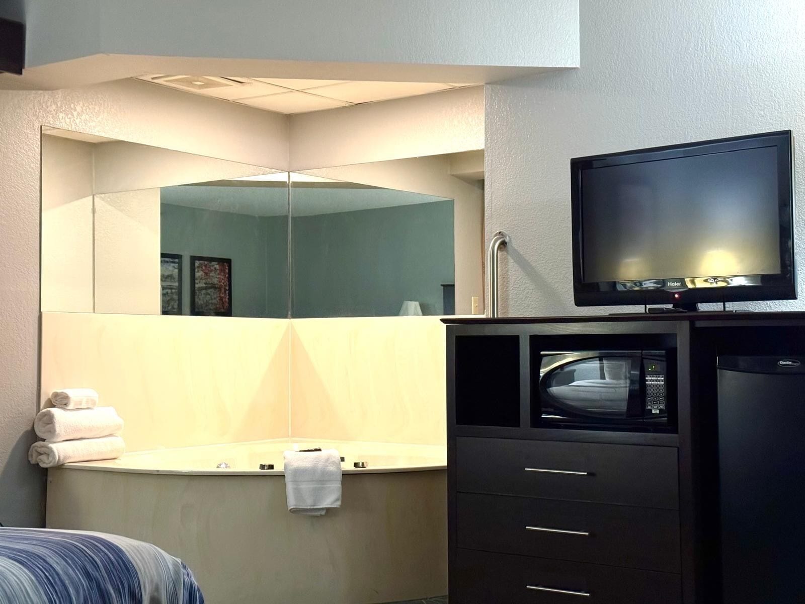 deluxe studio suite, 1 king bed, non smoking | desk, laptop workspace, blackout curtains, iron/ironing board