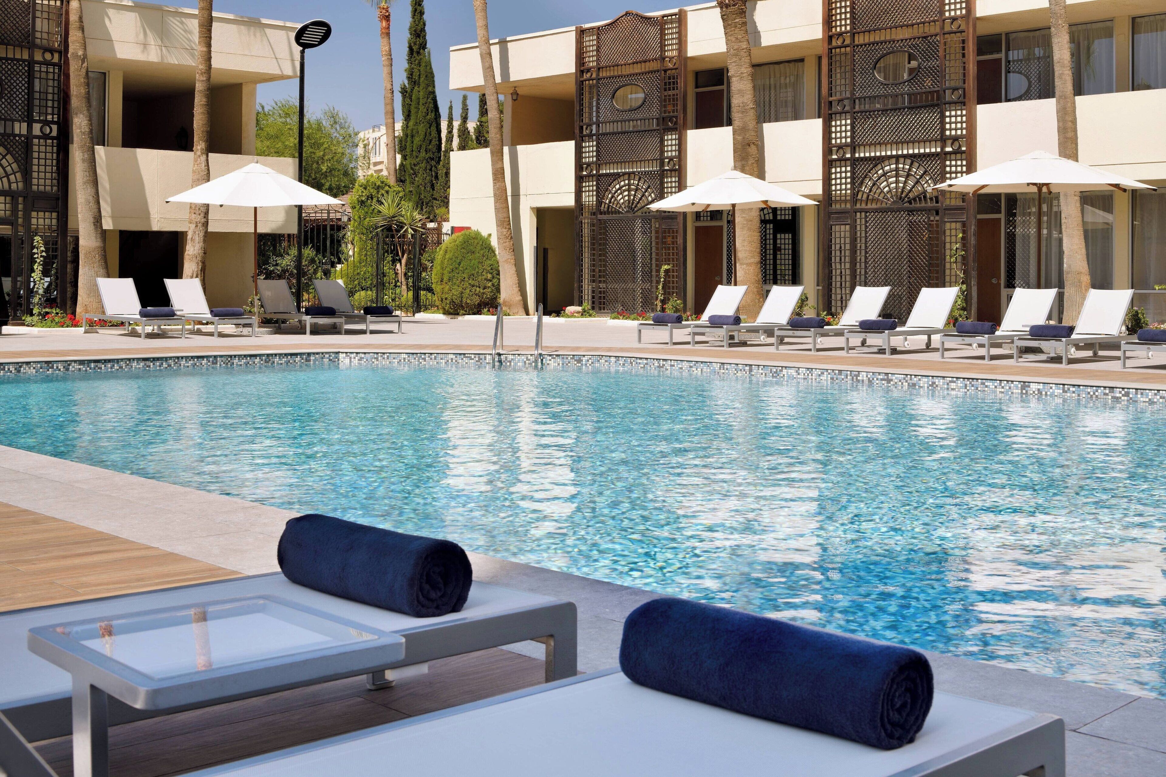 indoor pool, seasonal outdoor pool, pool umbrellas, pool loungers