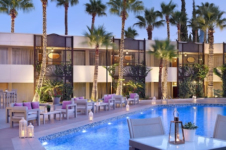 Indoor pool, seasonal outdoor pool, pool umbrellas, sun loungers. Amman Marriott Hotel