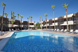 Indoor pool, seasonal outdoor pool, pool umbrellas, pool loungers