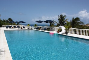 Outdoor pool, pool umbrellas, sun loungers