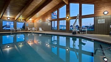 Indoor pool, open 6:00 AM to noon, pool loungers