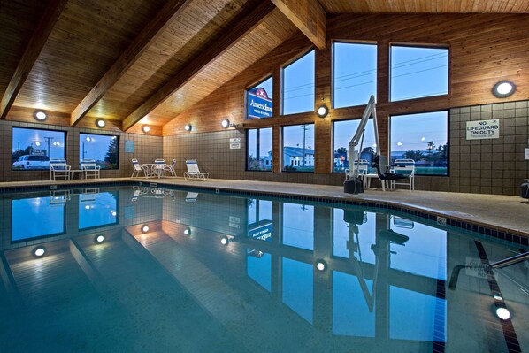 Indoor pool, open 6:00 AM to noon, pool loungers