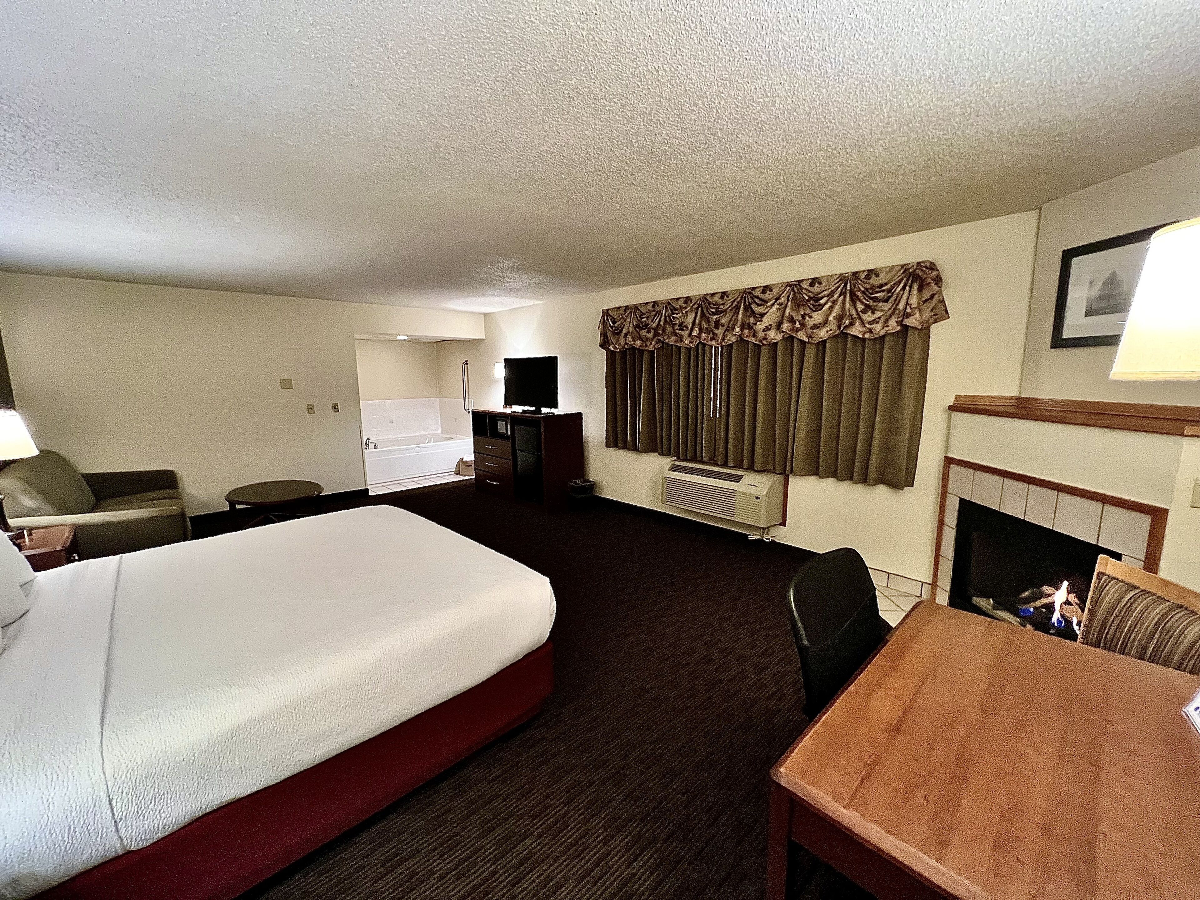 premier studio suite, 1 king bed, non smoking | desk, blackout curtains, soundproofing, iron/ironing board