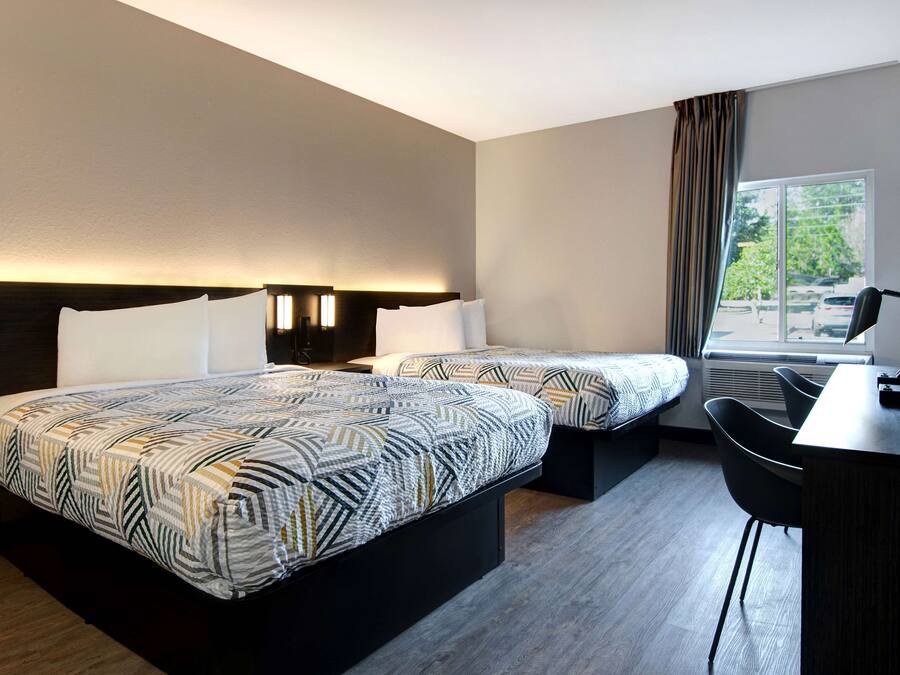 Desk, laptop workspace, blackout drapes, iron/ironing board