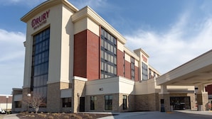 A Drury Inn & Suites building with a brick facade, large windows, and a covered entrance. - Drury Inn & Suites Kansas City Overland Park (Overland Park)