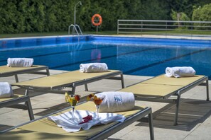 Seasonal outdoor pool, pool loungers