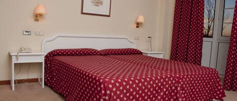 Desk, blackout drapes, iron/ironing board, free cribs/infant beds