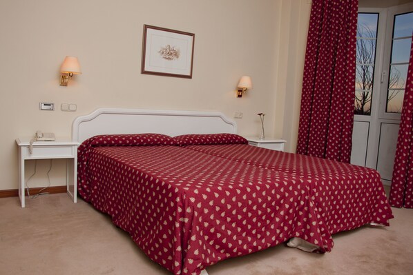 Desk, blackout curtains, iron/ironing board, free cots/infant beds