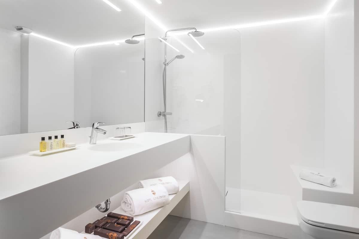 combined shower/bathtub, designer toiletries, hair dryer, bidet