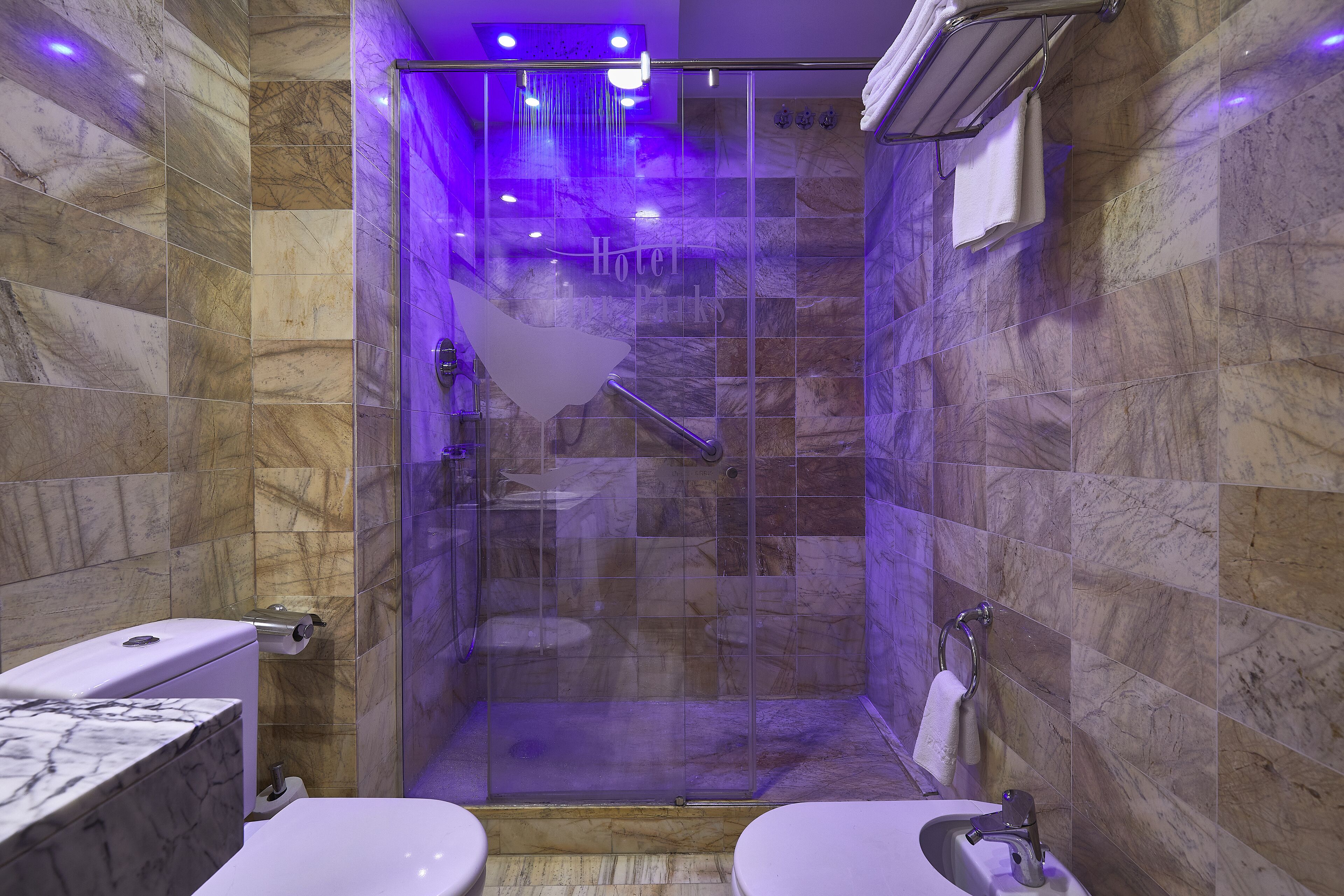 standard double room | bathroom | rainfall showerhead, designer toiletries, hair dryer, bidet
