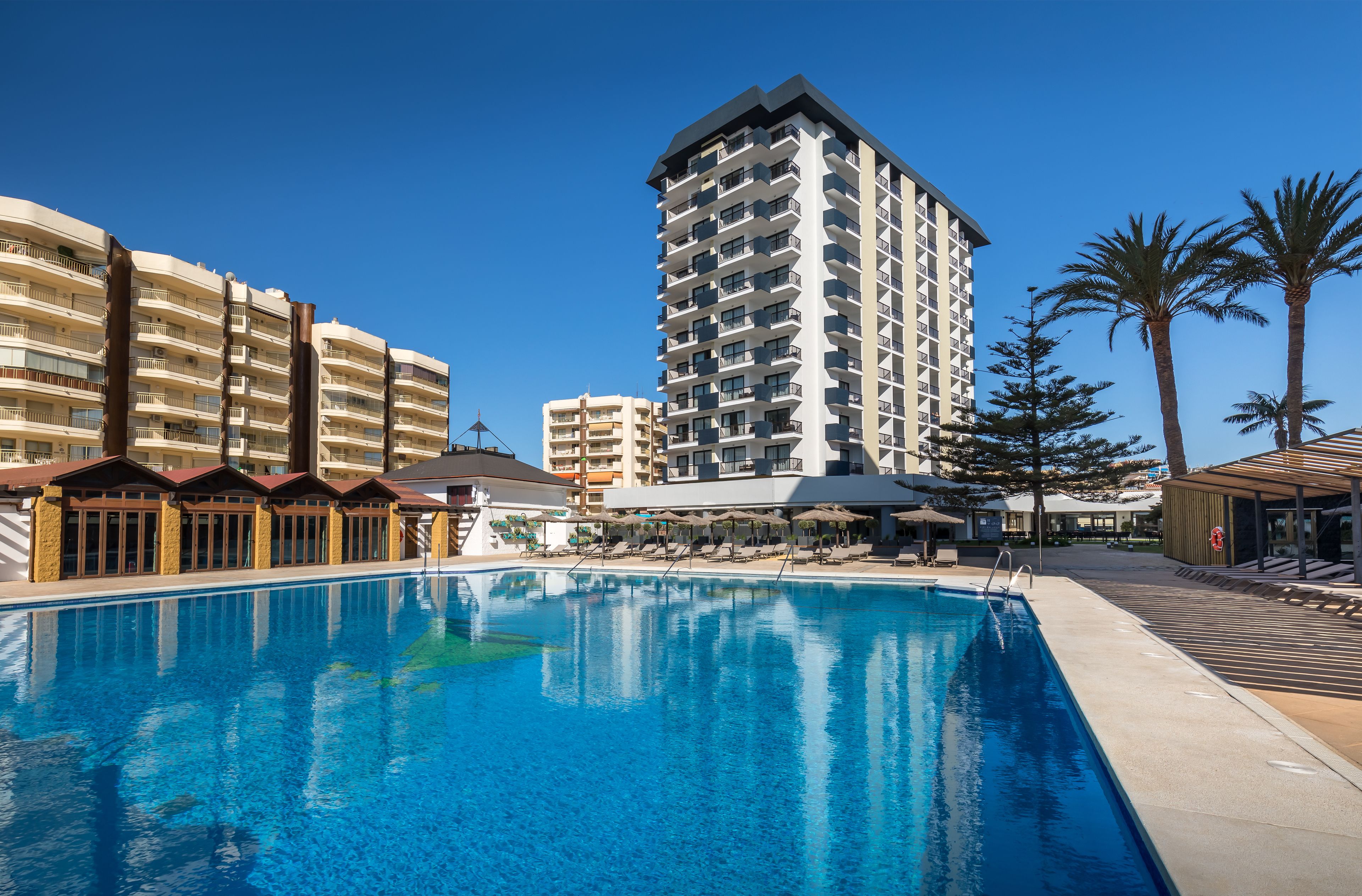 outdoor pool, pool umbrellas, pool loungers