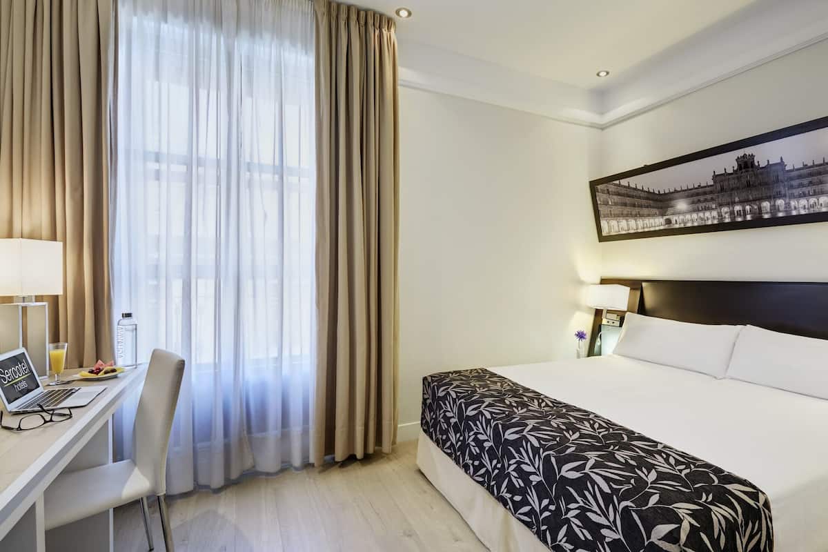 Classic Double Room | Minibar, in-room safe, desk, laptop workspace