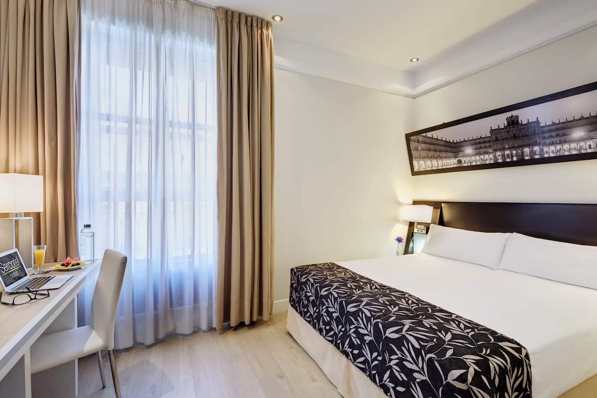 Classic Double Room | Minibar, in-room safe, desk, laptop workspace