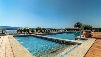 Indoor pool, seasonal outdoor pool, pool umbrellas, sun loungers