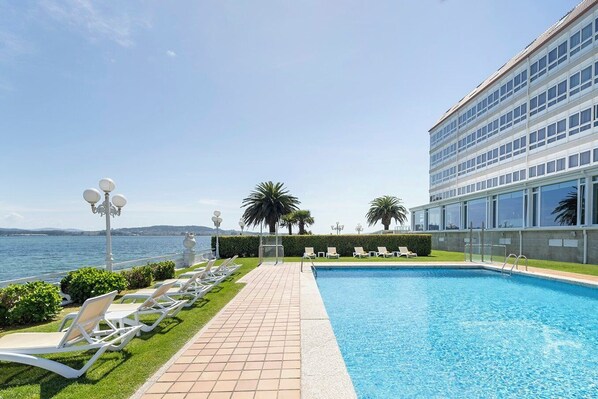 Indoor pool, seasonal outdoor pool, pool umbrellas, pool loungers
