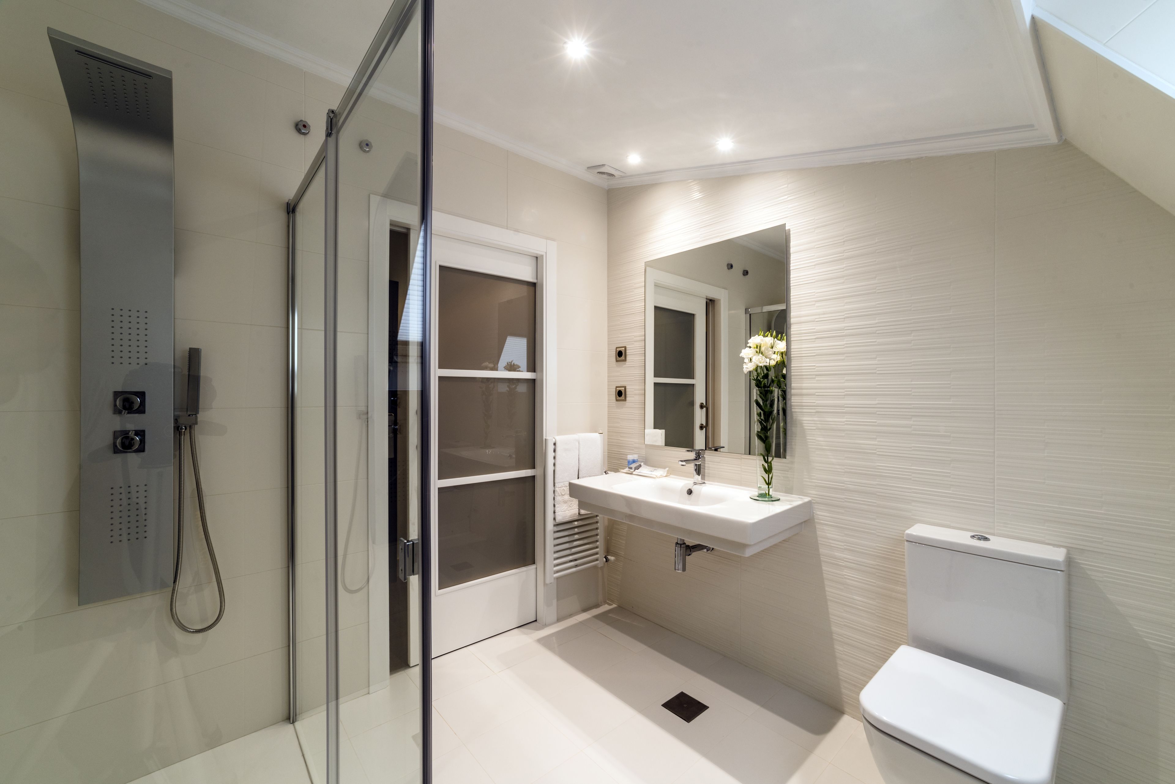 combined shower/bathtub, designer toiletries, hair dryer, bidet