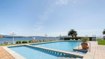 Indoor pool, seasonal outdoor pool, pool umbrellas, pool loungers