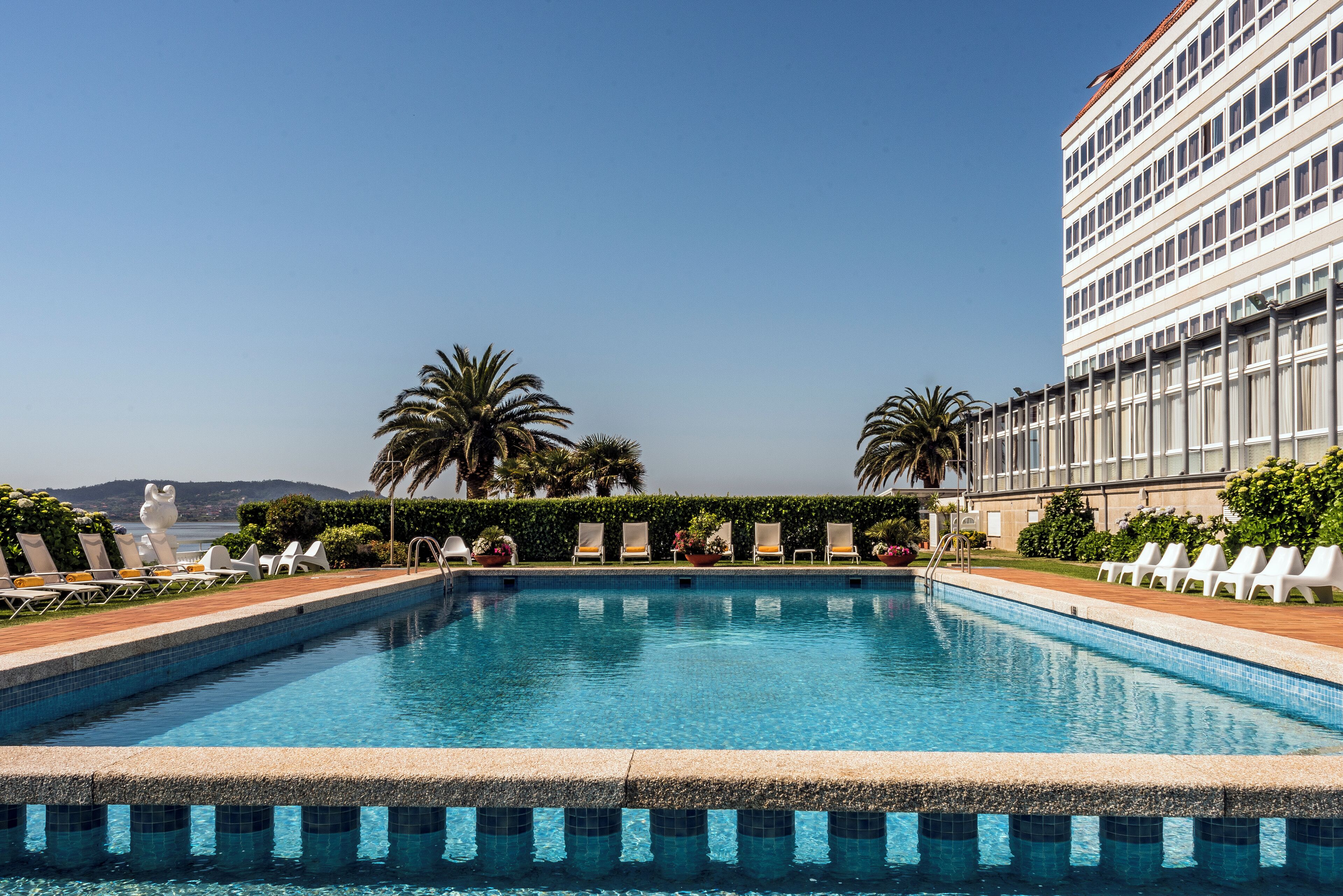 indoor pool, seasonal outdoor pool, pool umbrellas, pool loungers