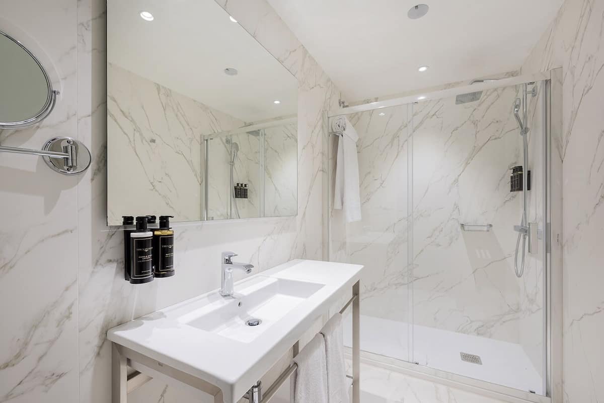 Bathroom | Shower, designer toiletries, hair dryer, towels