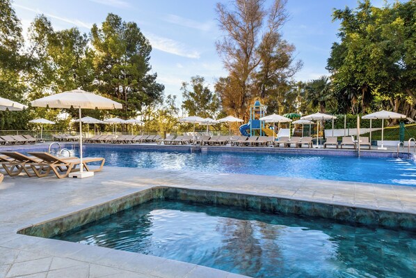 2 outdoor pools, pool umbrellas, pool loungers