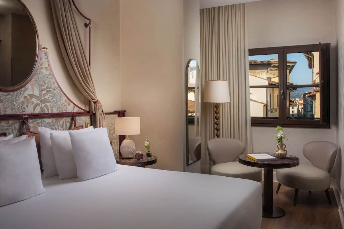 Gherardini Junior Suite | Minibar, in-room safe, individually decorated, desk