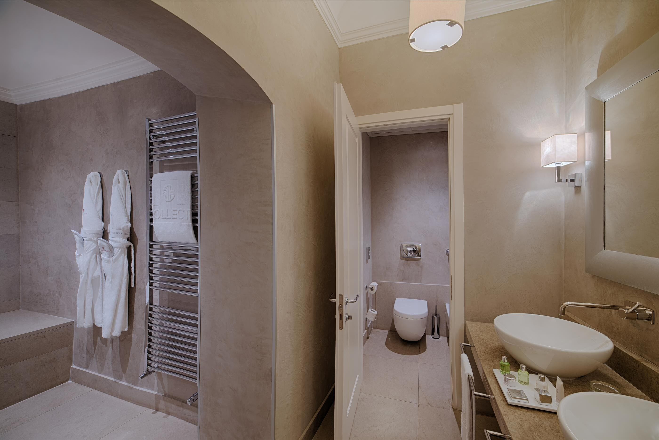 junior suite | bathroom | rainfall showerhead, eco-friendly toiletries, hair dryer, towels