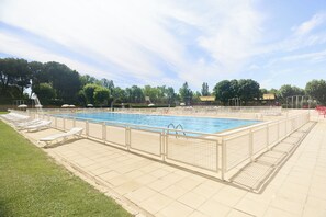Seasonal outdoor pool, pool umbrellas, pool loungers
