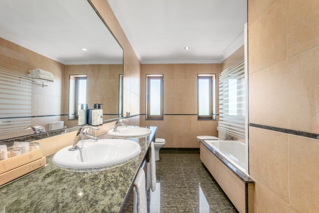 eco-friendly toiletries, hair dryer, bidet, towels