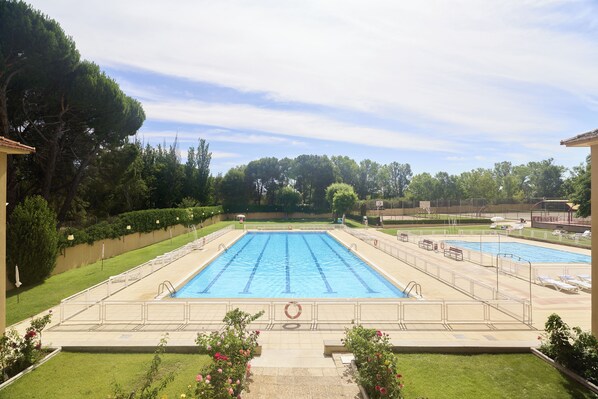 Seasonal outdoor pool, pool umbrellas, pool loungers