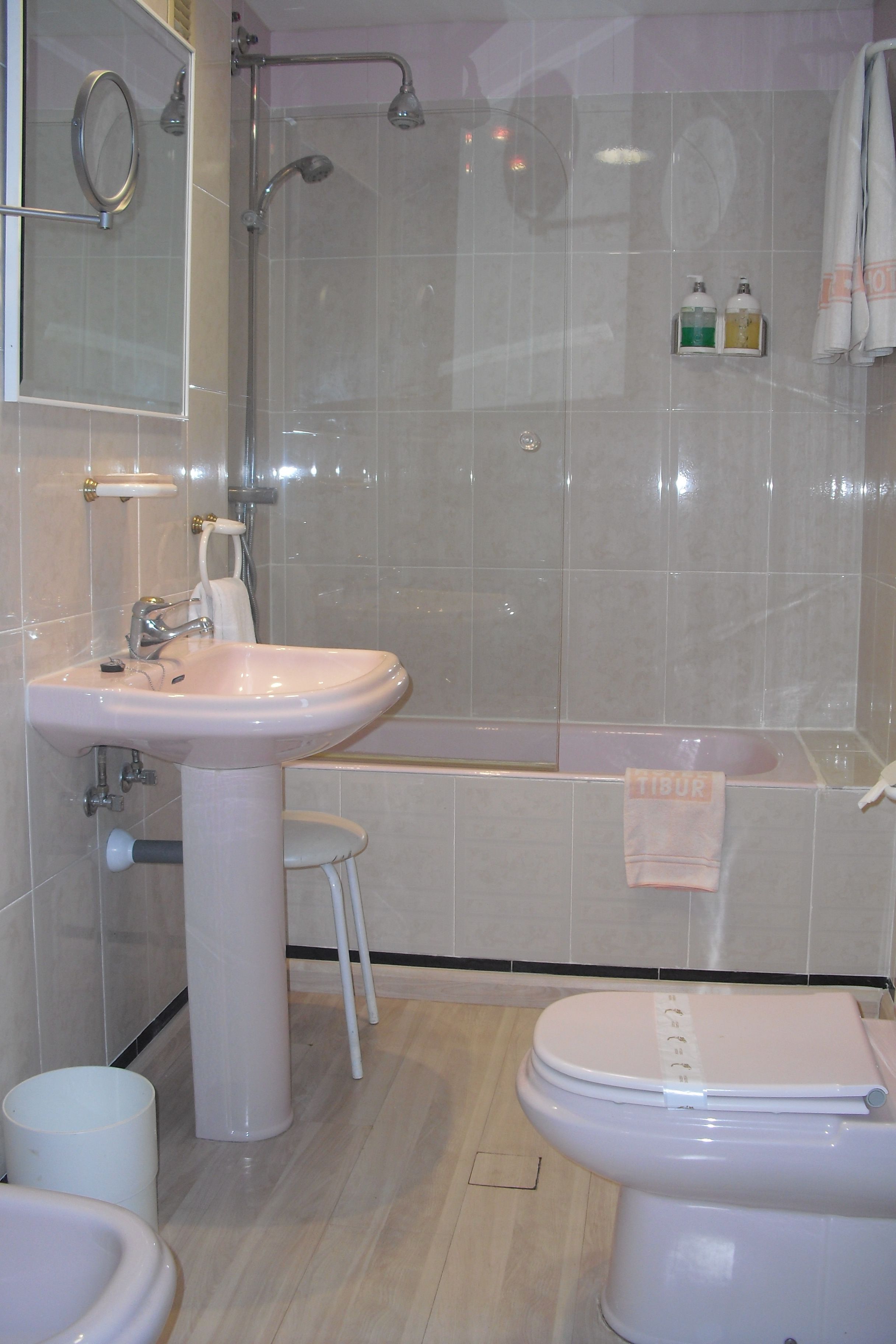 A bathroom with a sink, toilet, and bathtub.