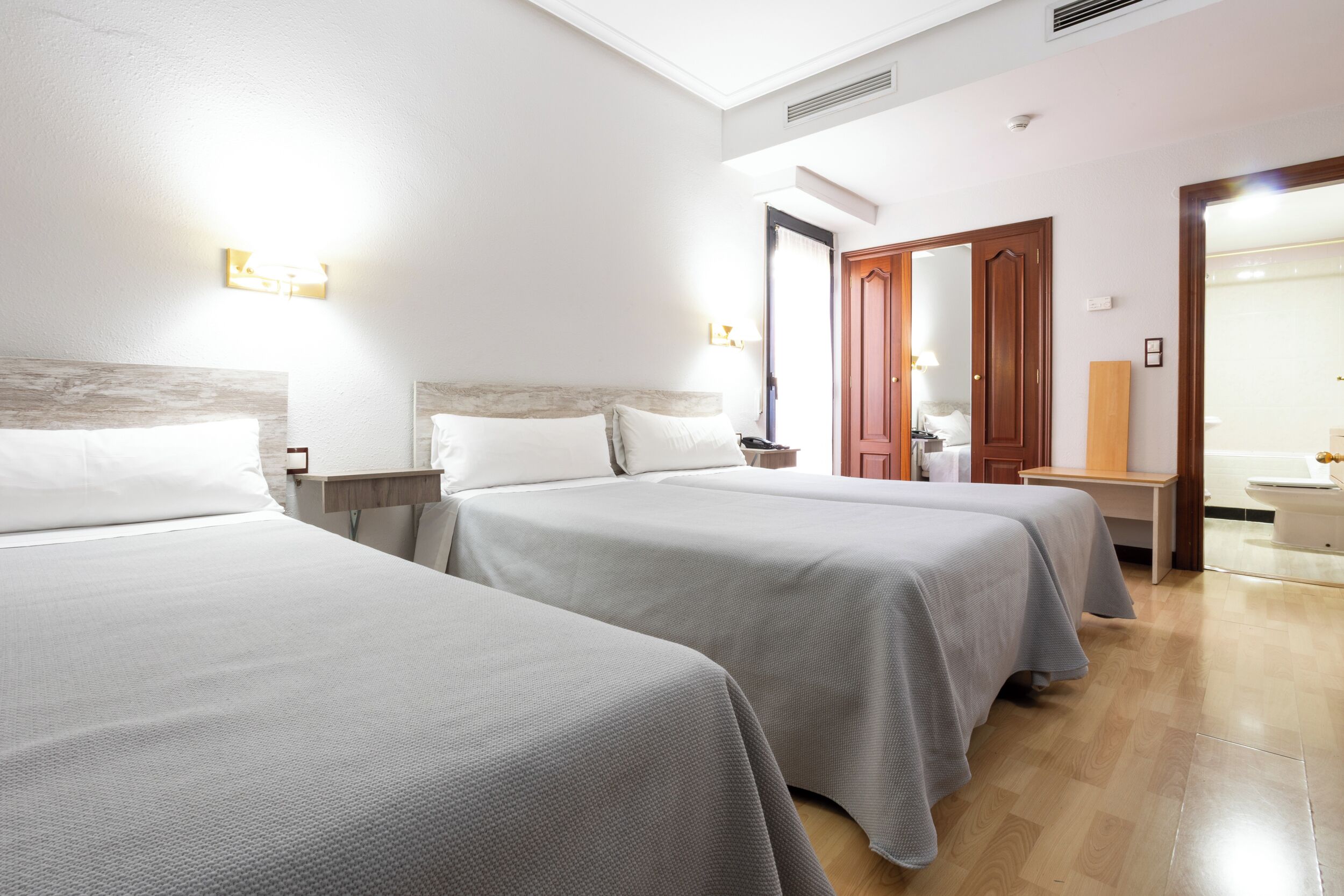 Triple Room | Minibar, in-room safe, desk, soundproofing