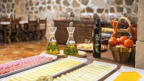 A buffet table with various food items and condiments. - Sercotel Toledo Imperial (Toledo)