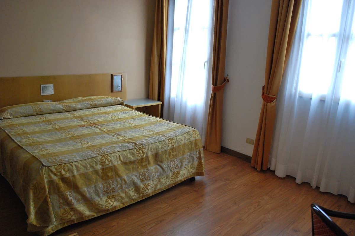 Economy Quadruple Room | Desk, blackout drapes, iron/ironing board, free WiFi