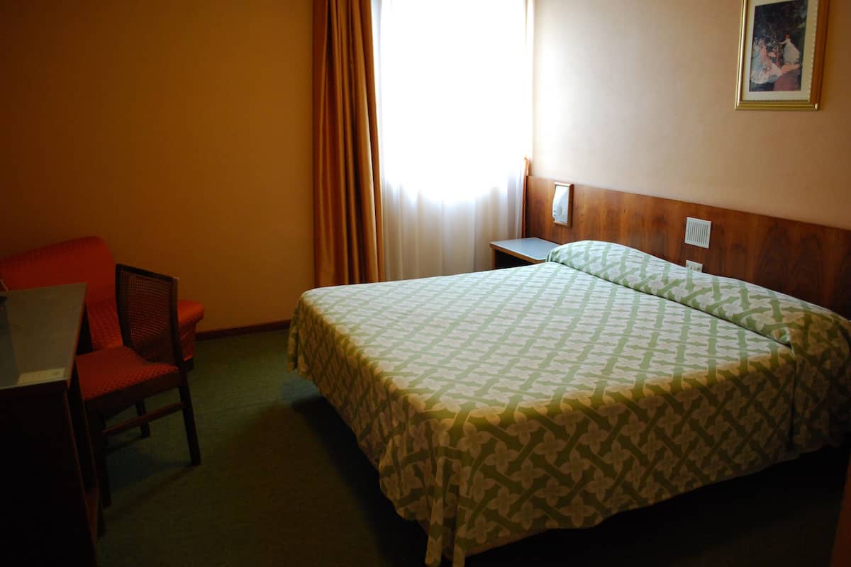 Economy Double or Twin Room | Desk, blackout drapes, iron/ironing board, free WiFi
