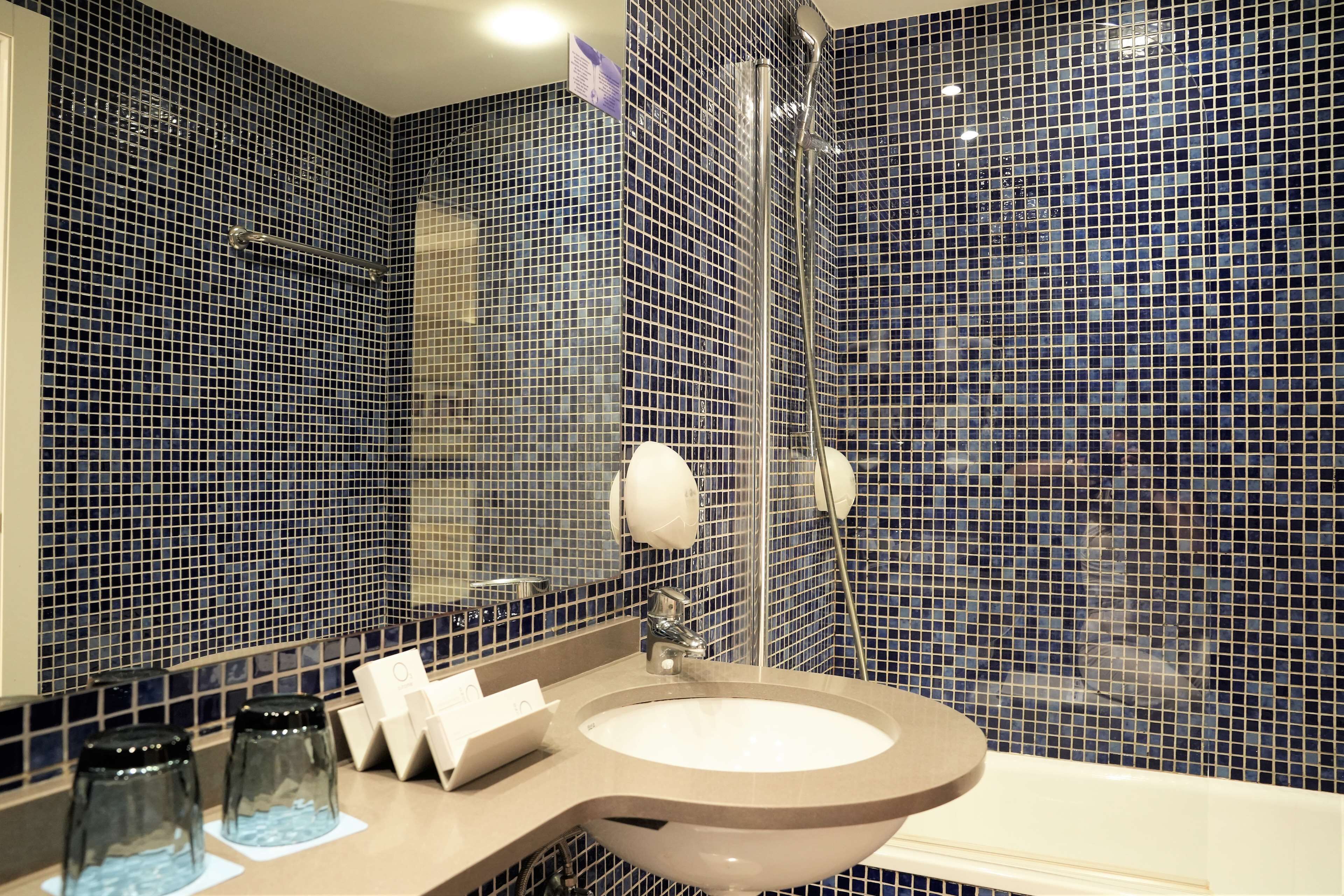 deep-soaking bathtub, free toiletries, hair dryer, towels