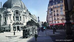 A historic building with a dome and ornate architecture, a tram, and a café in the background. - Hotel Hippodrome (Paris)