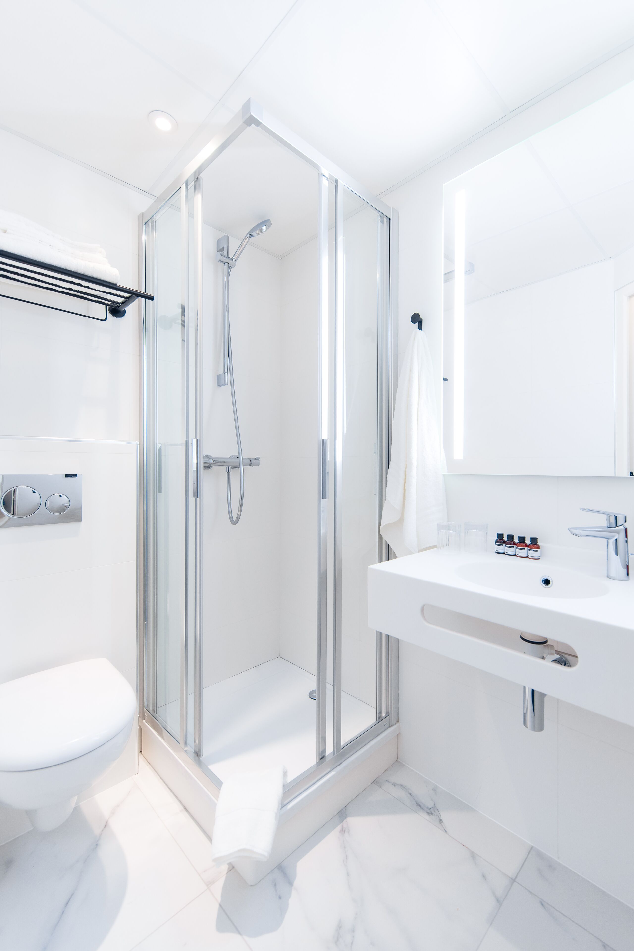 eco-friendly toiletries, hair dryer, towels, soap