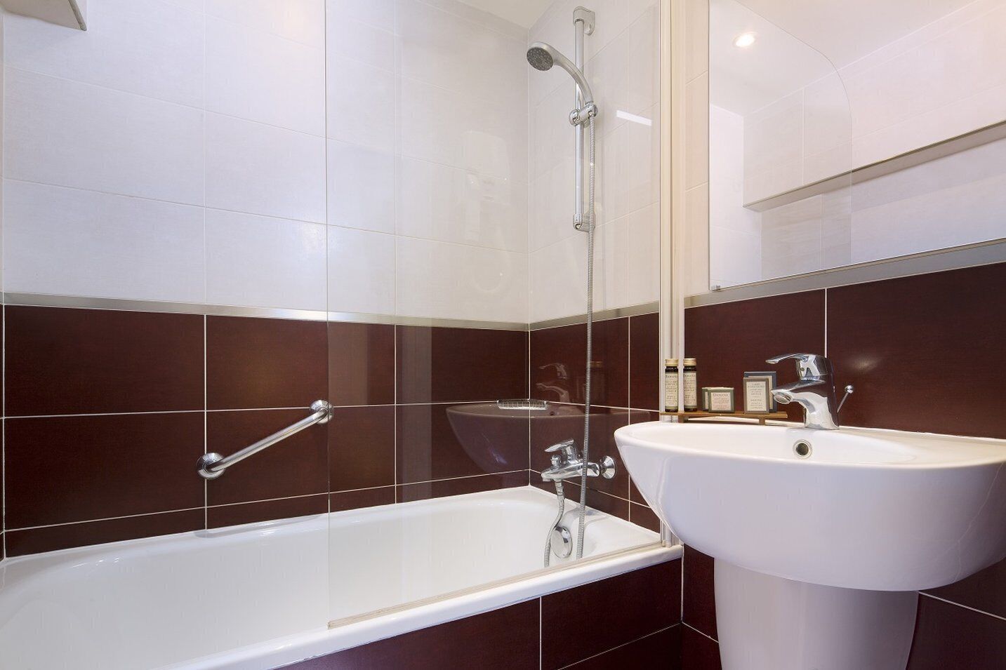 combined shower/bathtub, designer toiletries, hair dryer, bidet