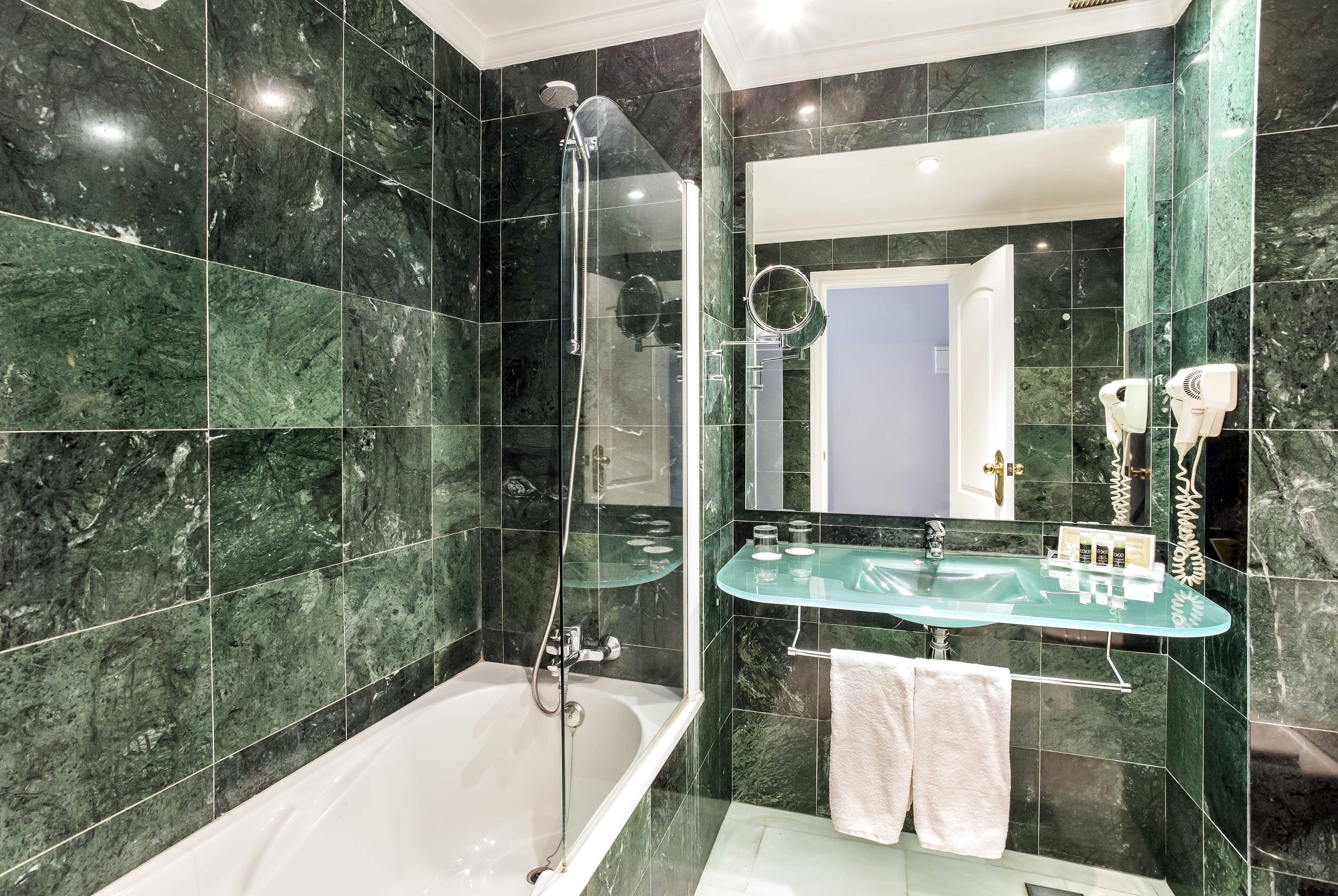 Shower, eco-friendly toiletries, hair dryer, towels