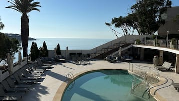 Outdoor pool, pool umbrellas, pool loungers