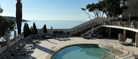 Outdoor pool, pool umbrellas, pool loungers
