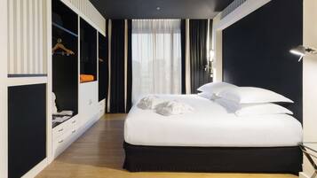 Premium bedding, down duvets, minibar, in-room safe